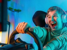 Pro Gamer Man playing computer games. Car Racing Online Video Game