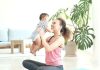 mother exercising postpartum with baby