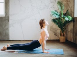 Yoga poses help ease chronic pain. (Photo via Pexels/Elina Fairytale)