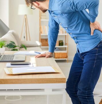 A computer user experiencing back pain