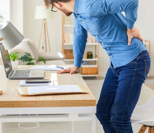 A computer user experiencing back pain