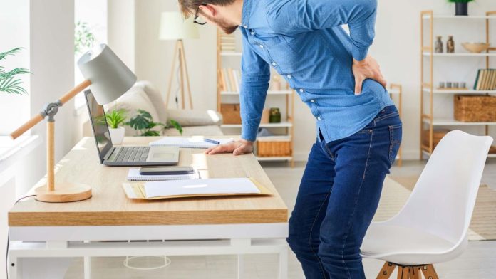 A computer user experiencing back pain